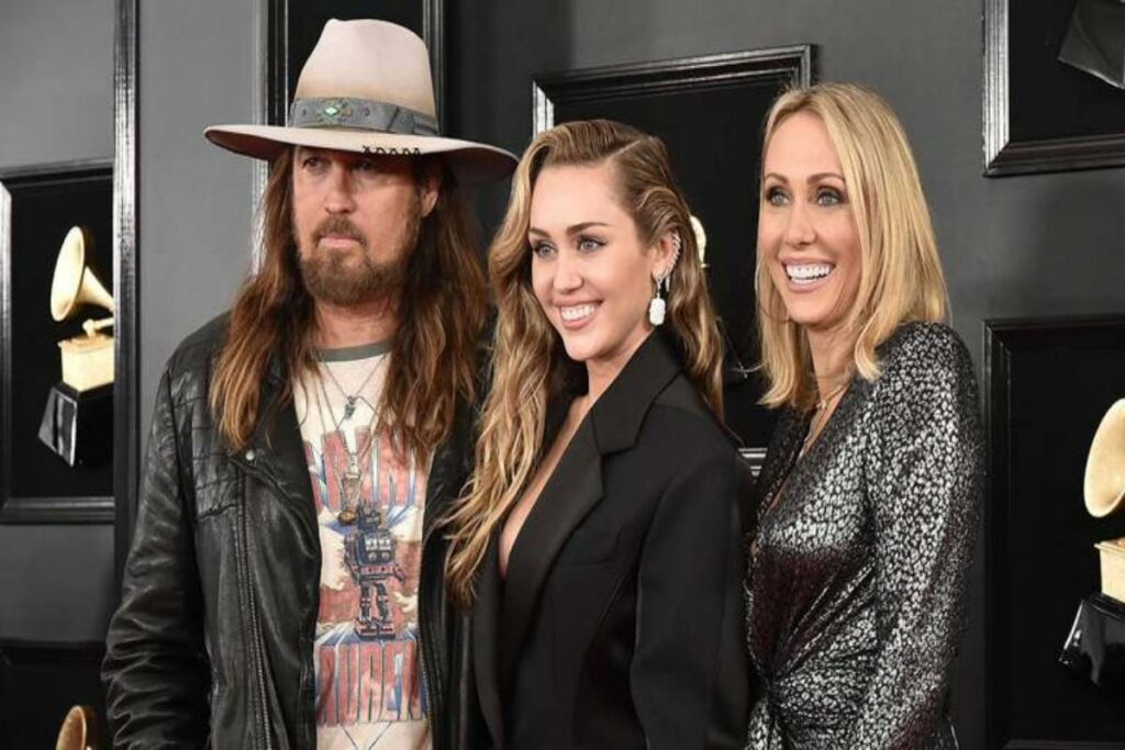 A picture of Tish Cyrus, her ex-husband and their daughter