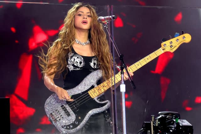 A Picture of Shakira Playing Guitar at Her Surprise Performance