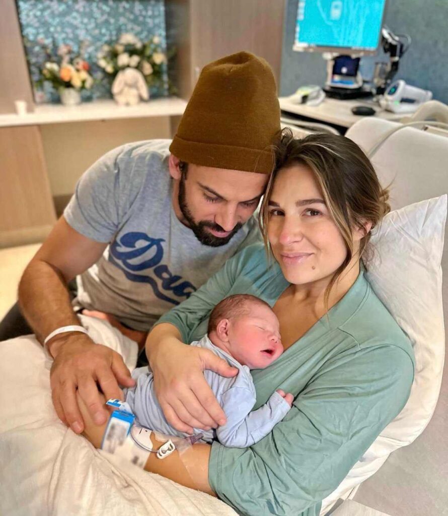 A picture of Jessie James and Eric Decker with their newborn