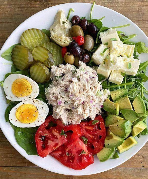 A picture of mixed vegetables including avocado and eggs