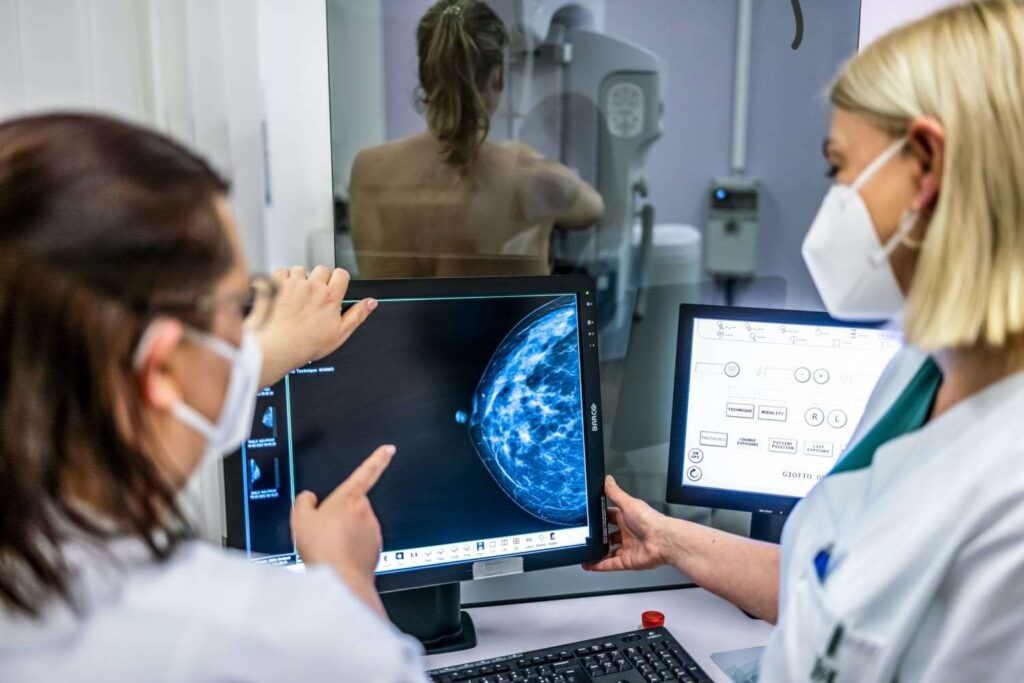 A Picture of Healthcare Providers Performing a Breast Cancer Examination 