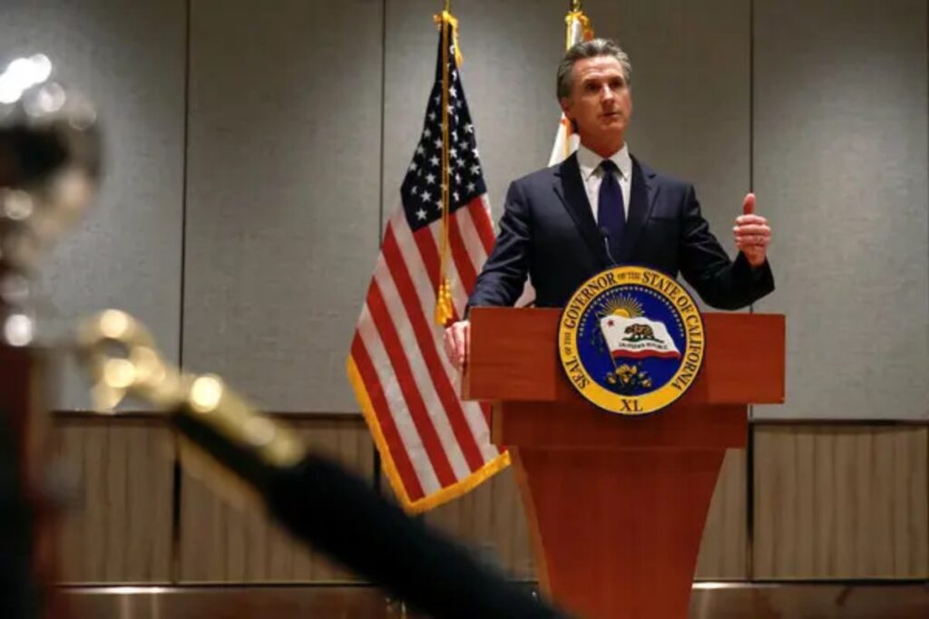 A Picture of California Governor, Gavin Newsom, Addressing the State Regarding the Budget Deficit