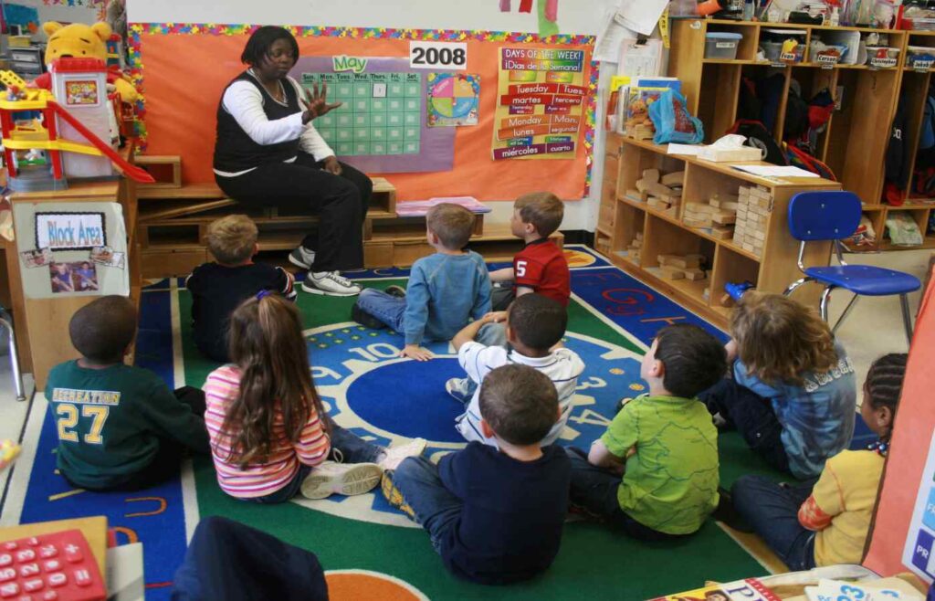 A Picture of a Primary School Teacher With Students