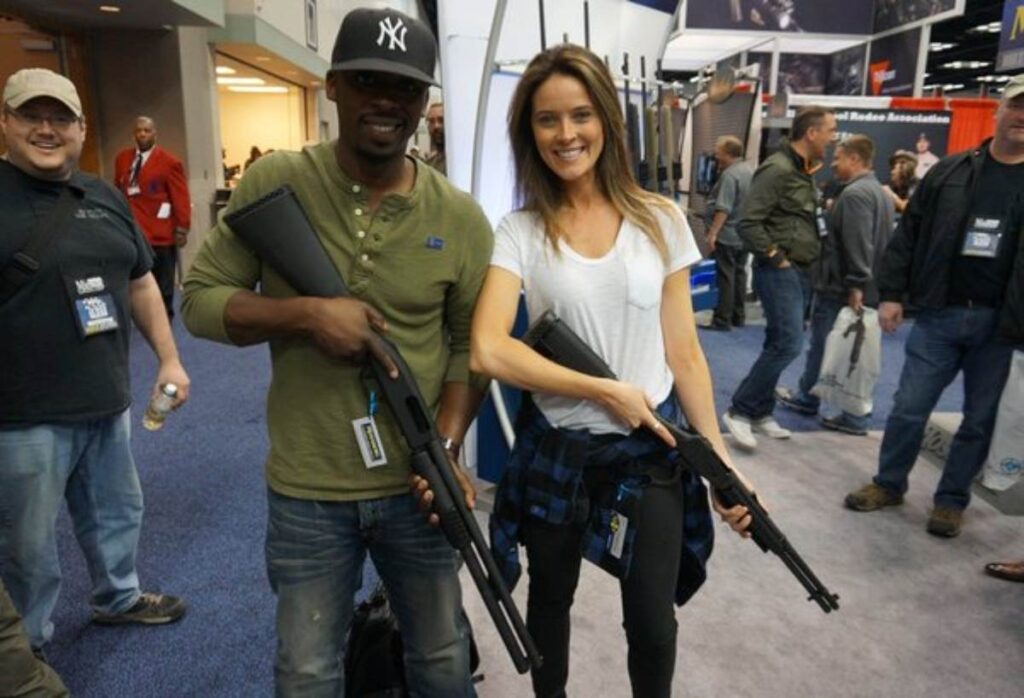 A Picture of Two People With Guns