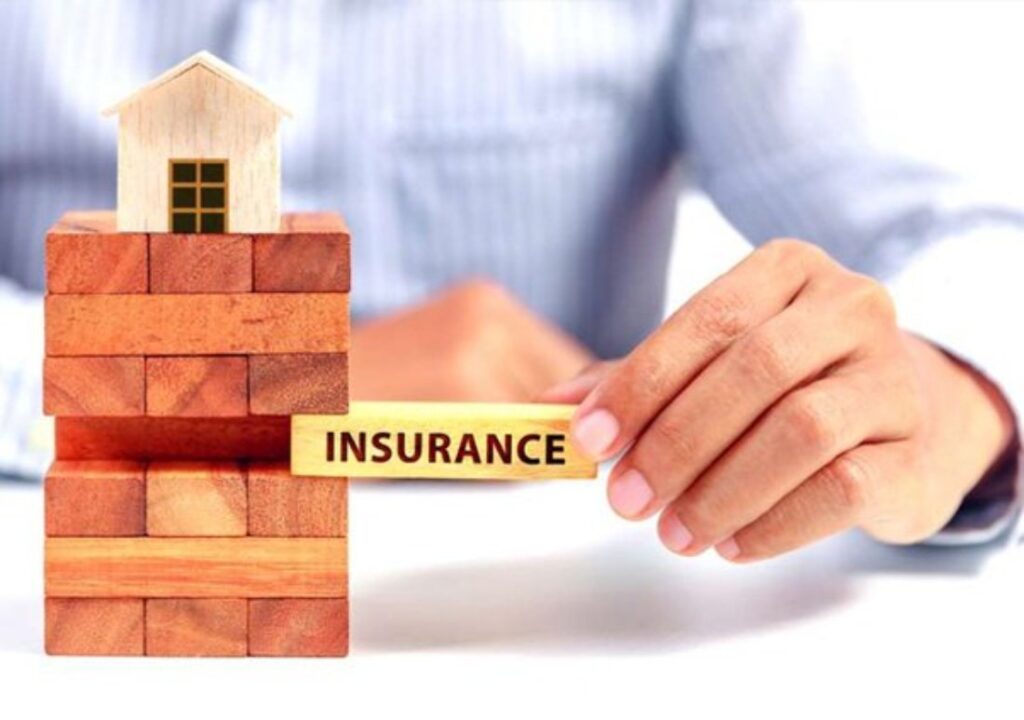 A Picture of a House and an Insurance Sign