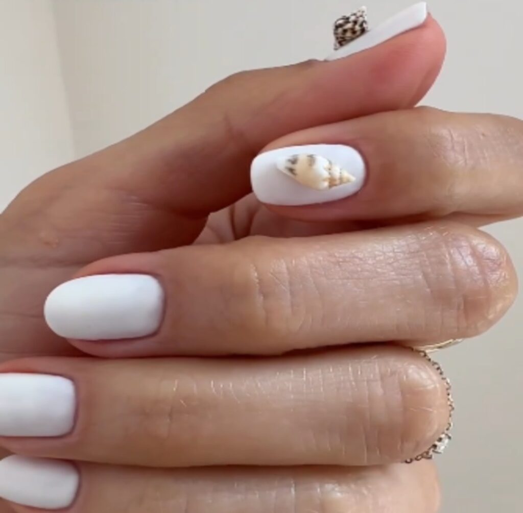 A picture of Seashell white nail look