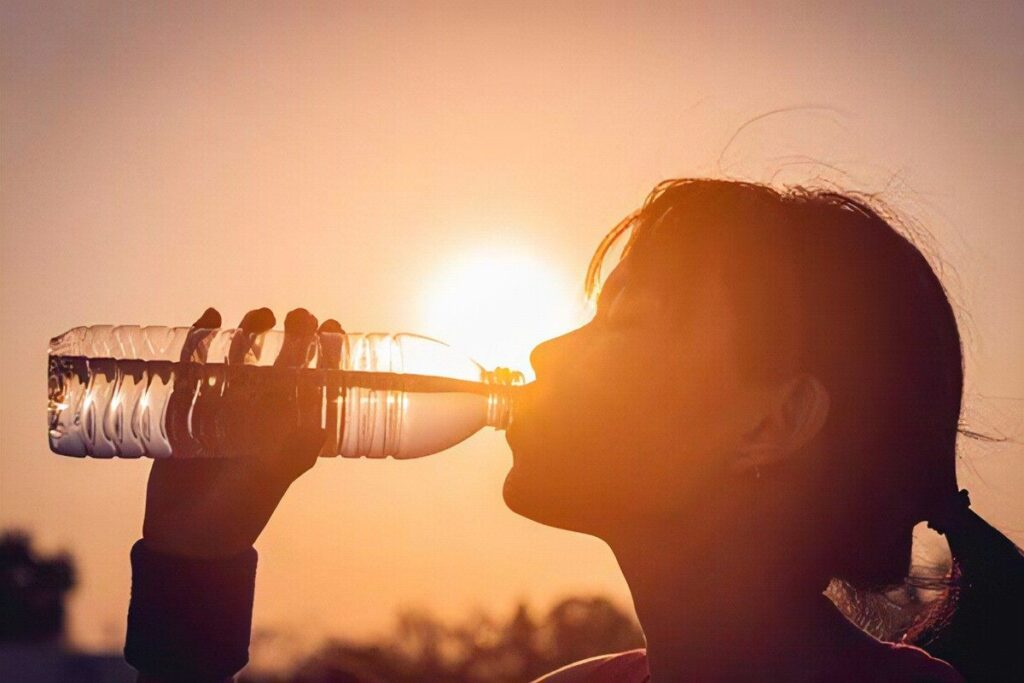 A Picture of a Woman Drinking Water