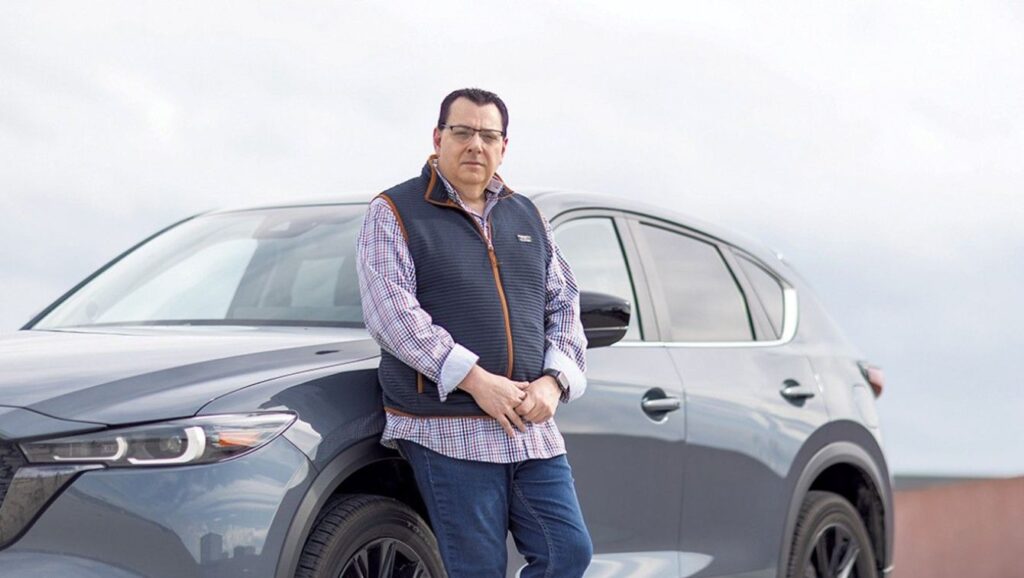 A Picture of a Vermont Driver and His Car