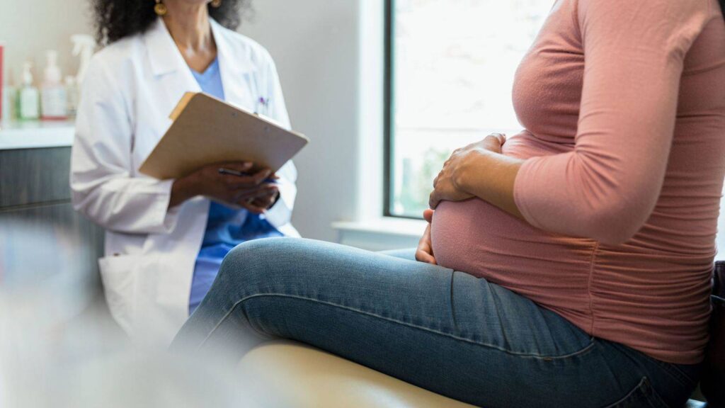 A Picture of a Pregnant Woman and a Doctor (1)