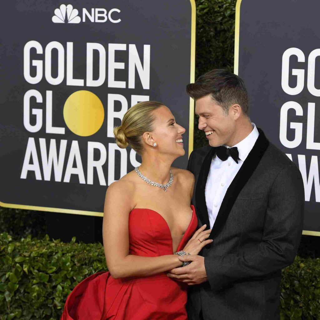 Scarlett Johanson staring into her husband's eye on the red carpet