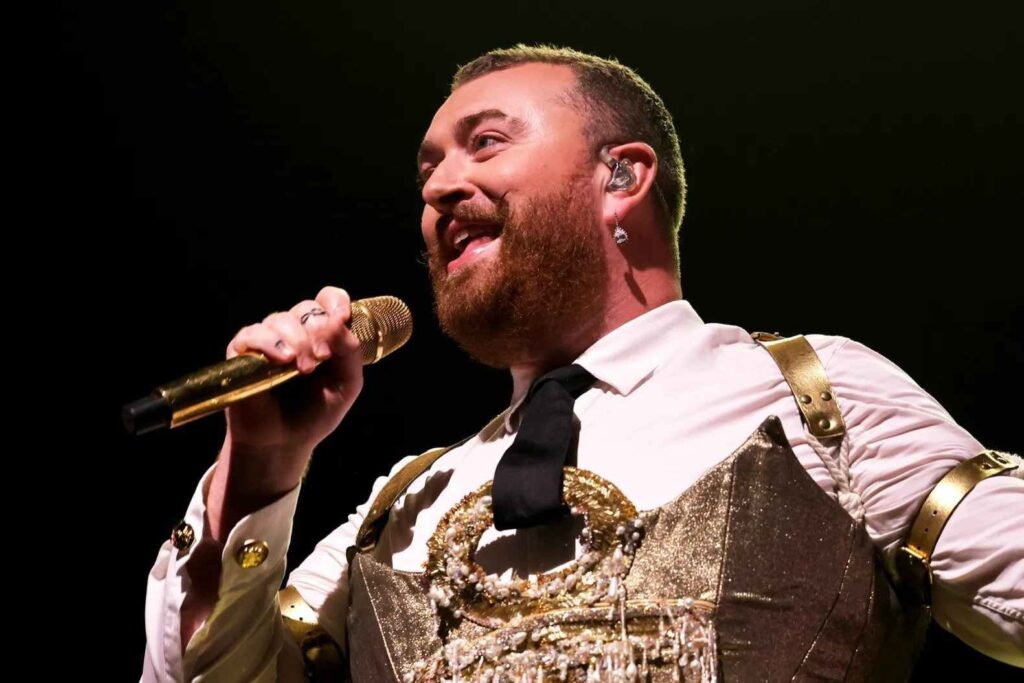 A bust shot of Sam Smith during a performance