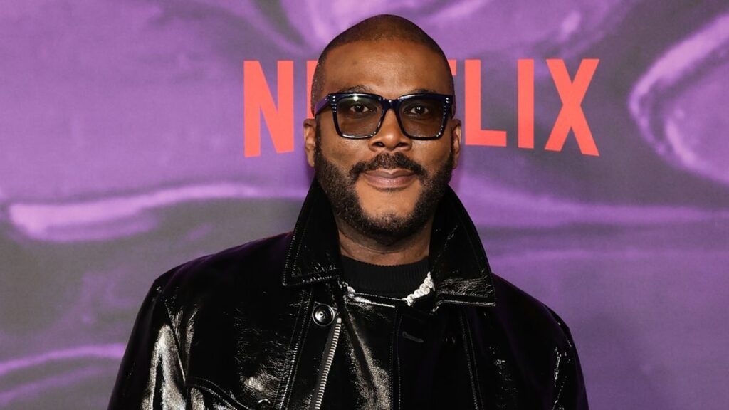 Tyler Perry posing on a red carpet