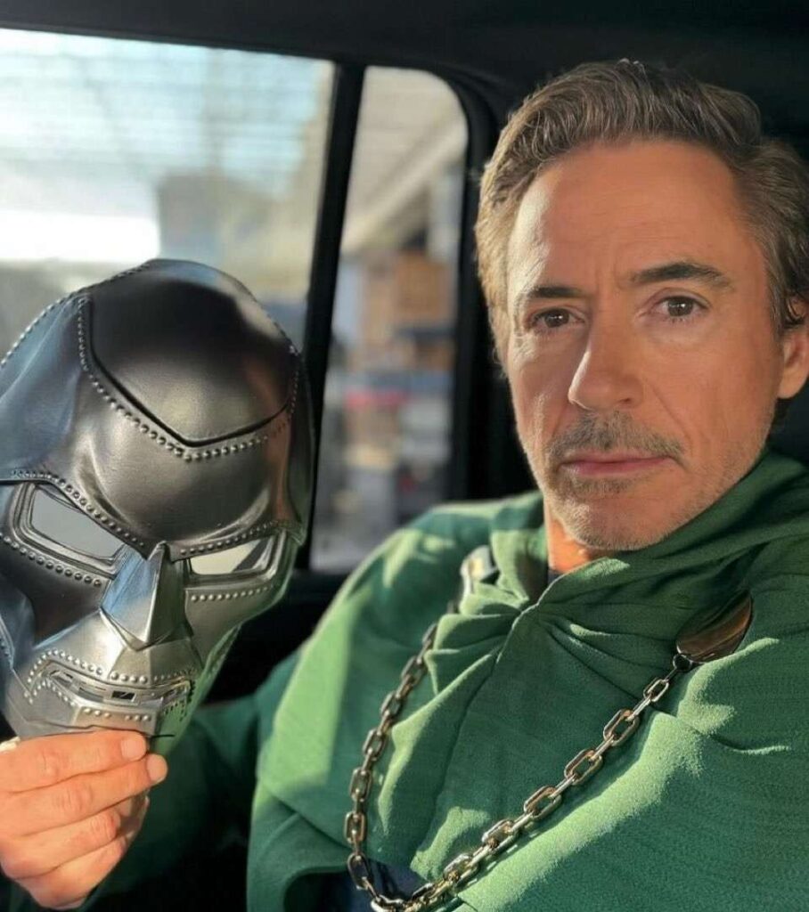 Robert Downey Jr holding the Dr Doom mask