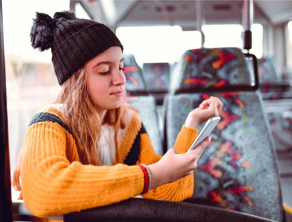 A Picture of a Girl Holding a Mobile Phone