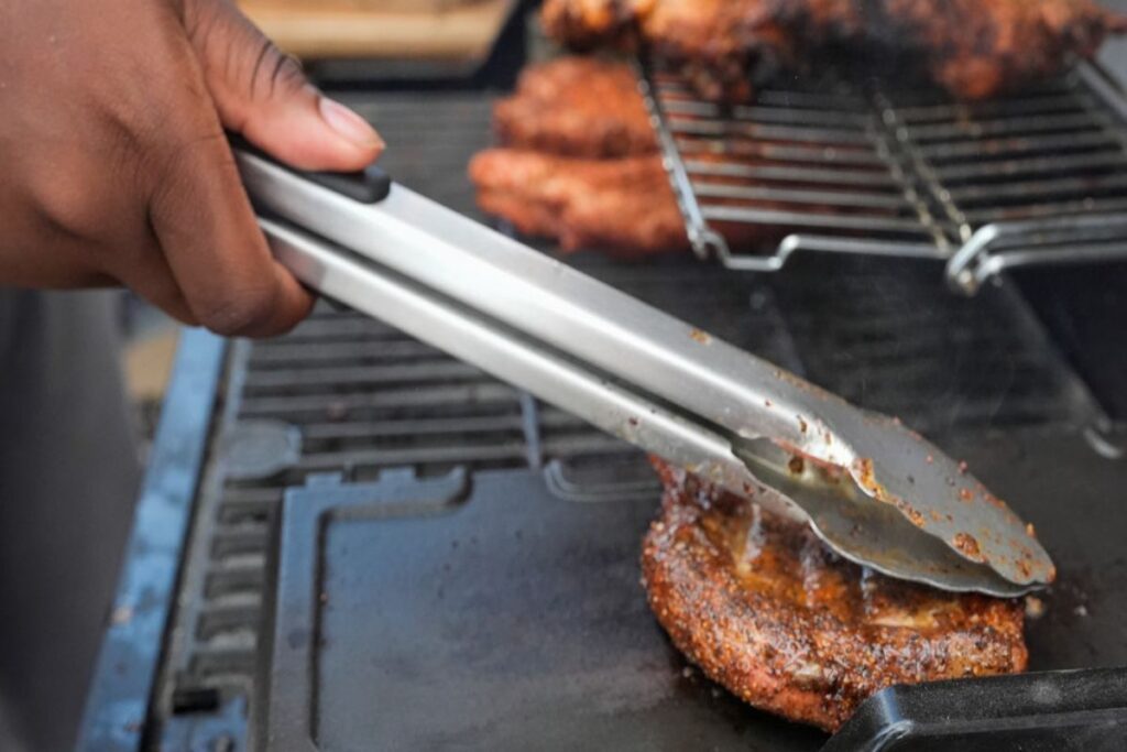 A Picture of Someone Making BBQ