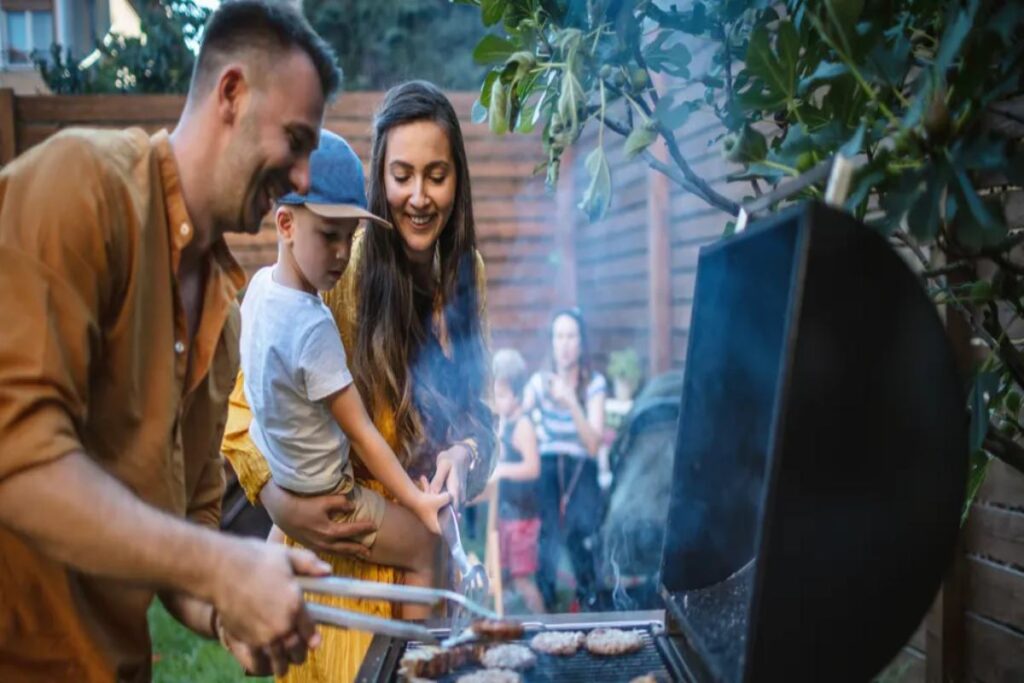 A Picture of a Couple Making BBQ