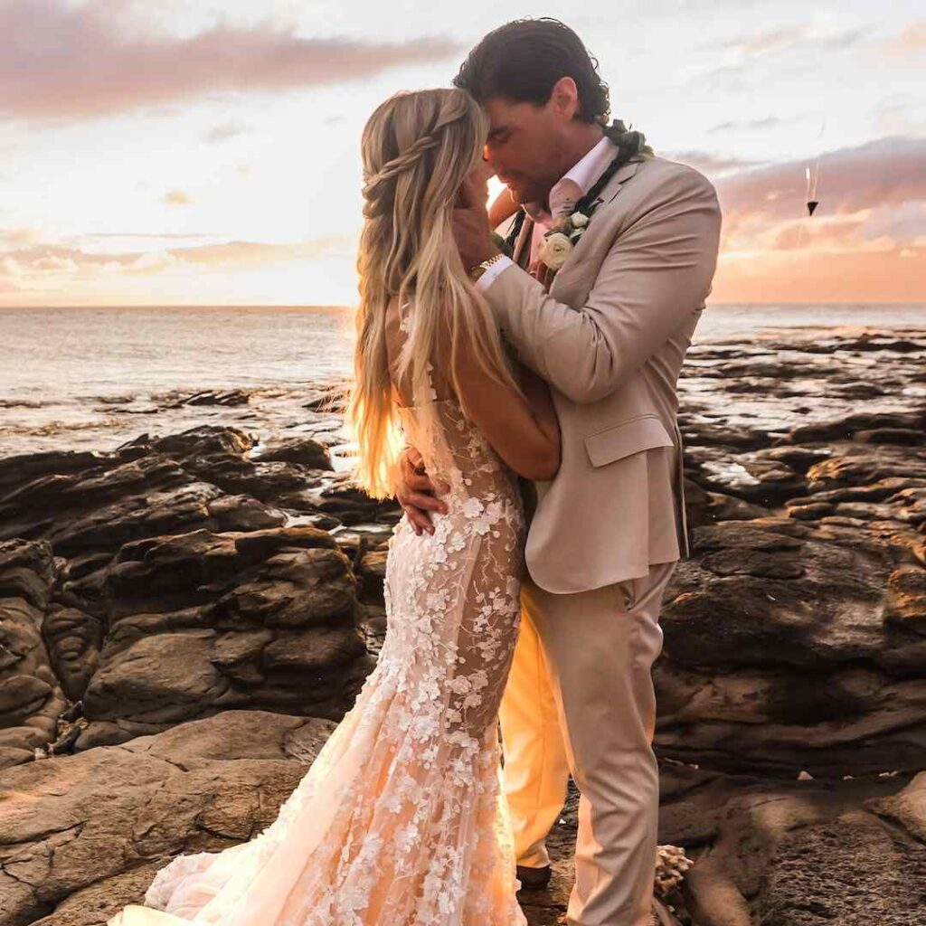 Joshua and Christina sharing a kiss on their wedding day