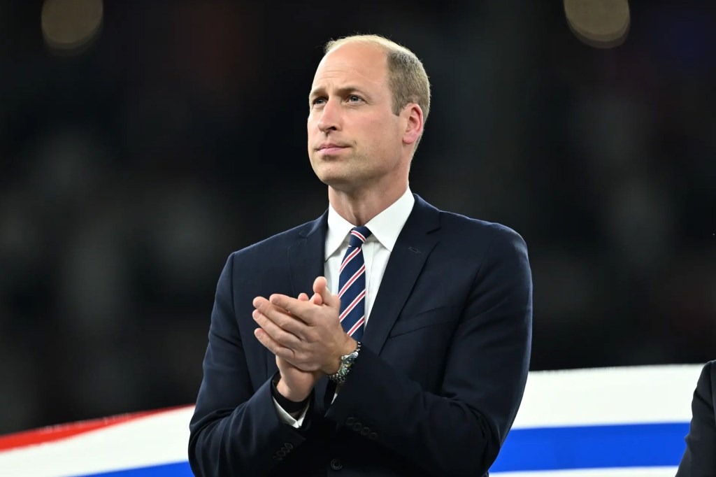 Prince William clapping