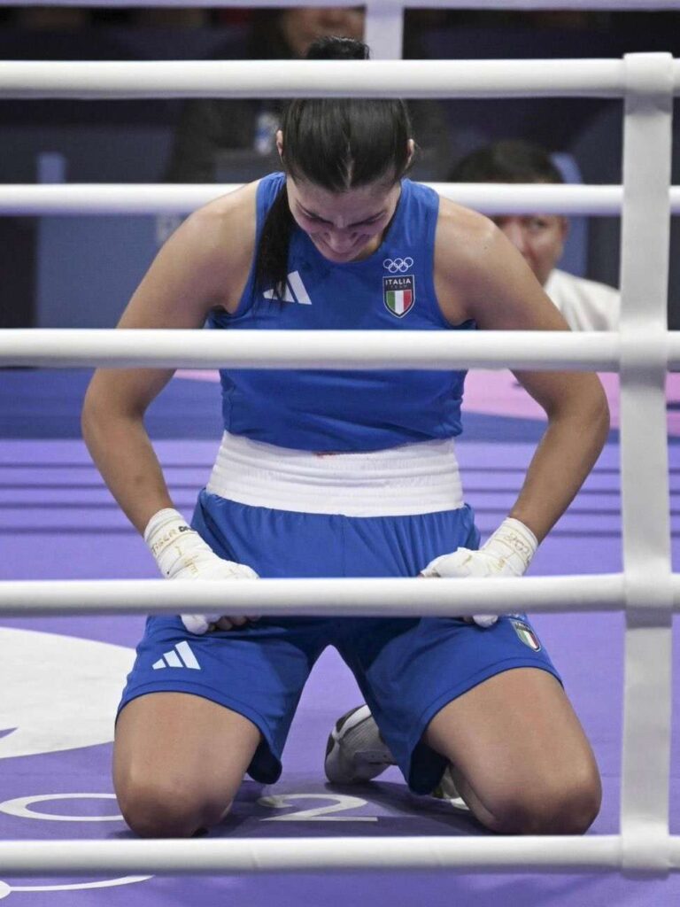 Carini on her knees in tears after the match