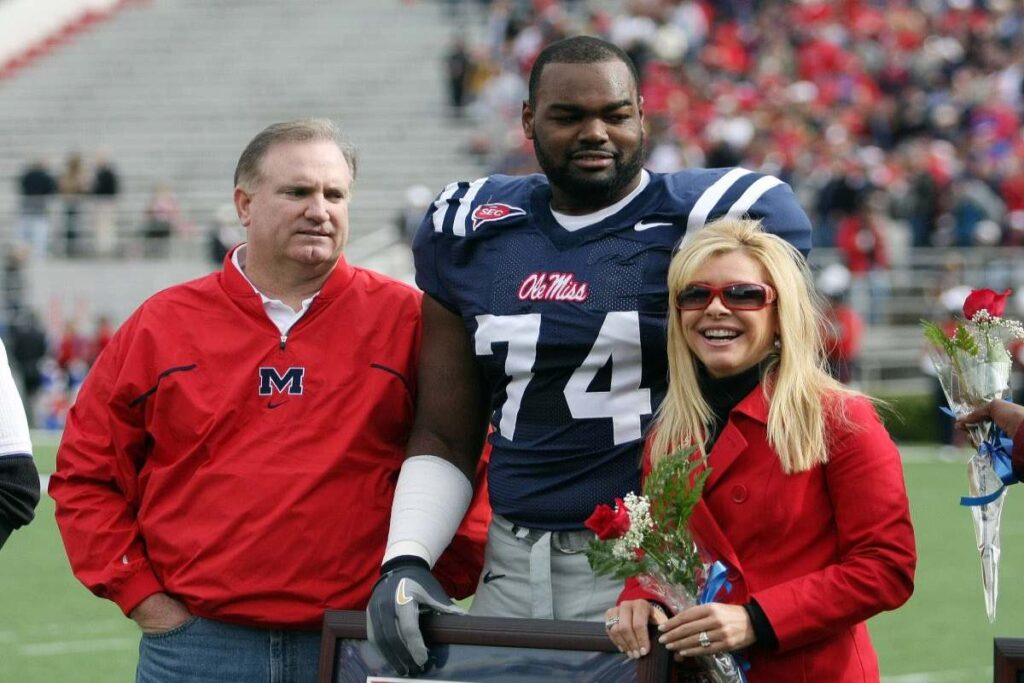 A Picture of Michael Oher and the Tuohys