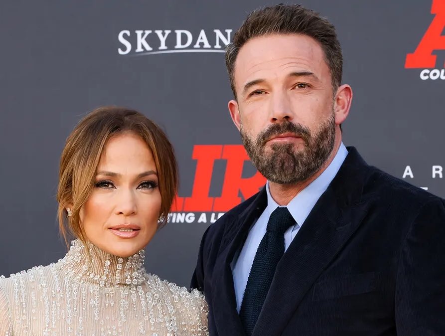 Ben Affleck and Jennifer Lopez posing on the red carpet