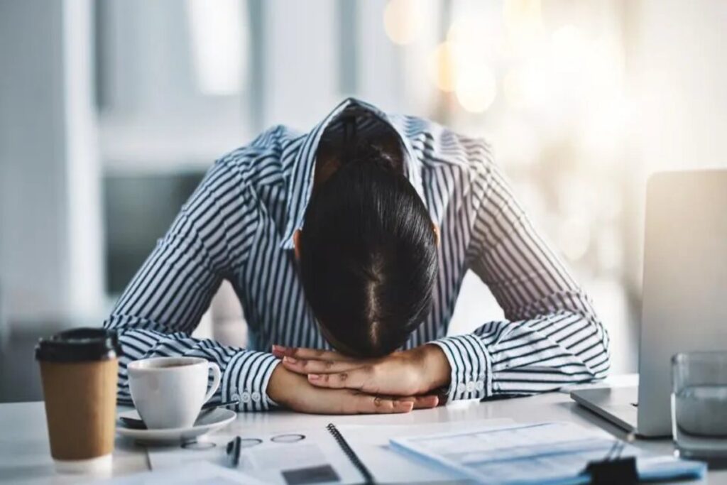 A Picture of a Woman Experiencing Brain Fatigue at Work