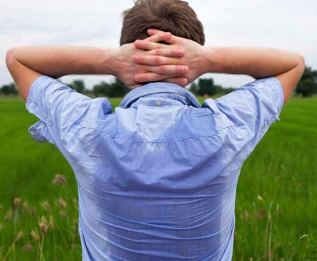 A man with a sweaty back