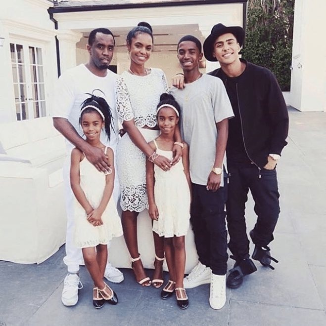 P Diddy and Kim Porter's children posing with them