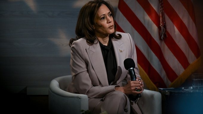 Kamala Harris holding a mic