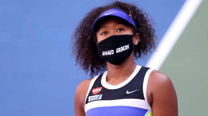 Naomi Osaka wearing a face mask 