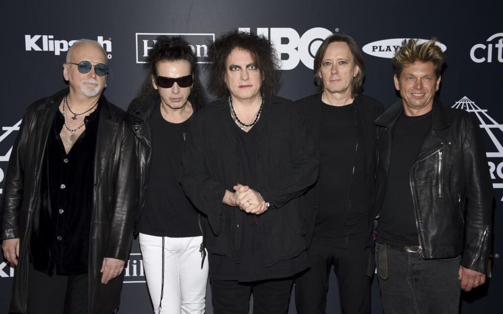 The Cure music band posing for a shot