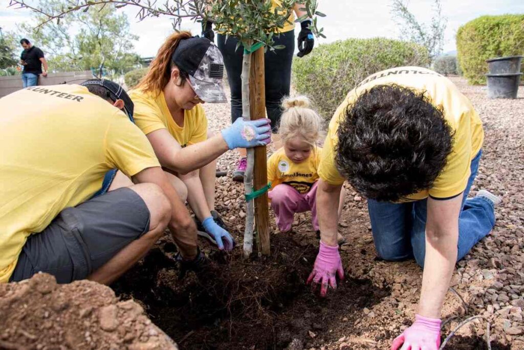 A group of people tree planting