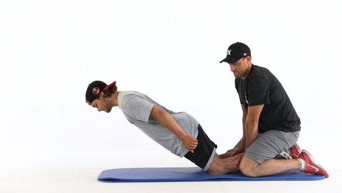 Two men in the middle of an exercise