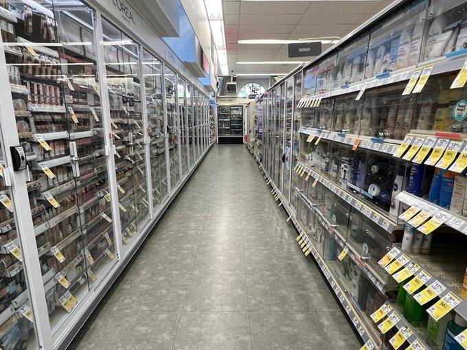 A Walgreens store with aisles under lock and key