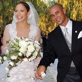 Cris Judd poses with Lopez on their wedding day